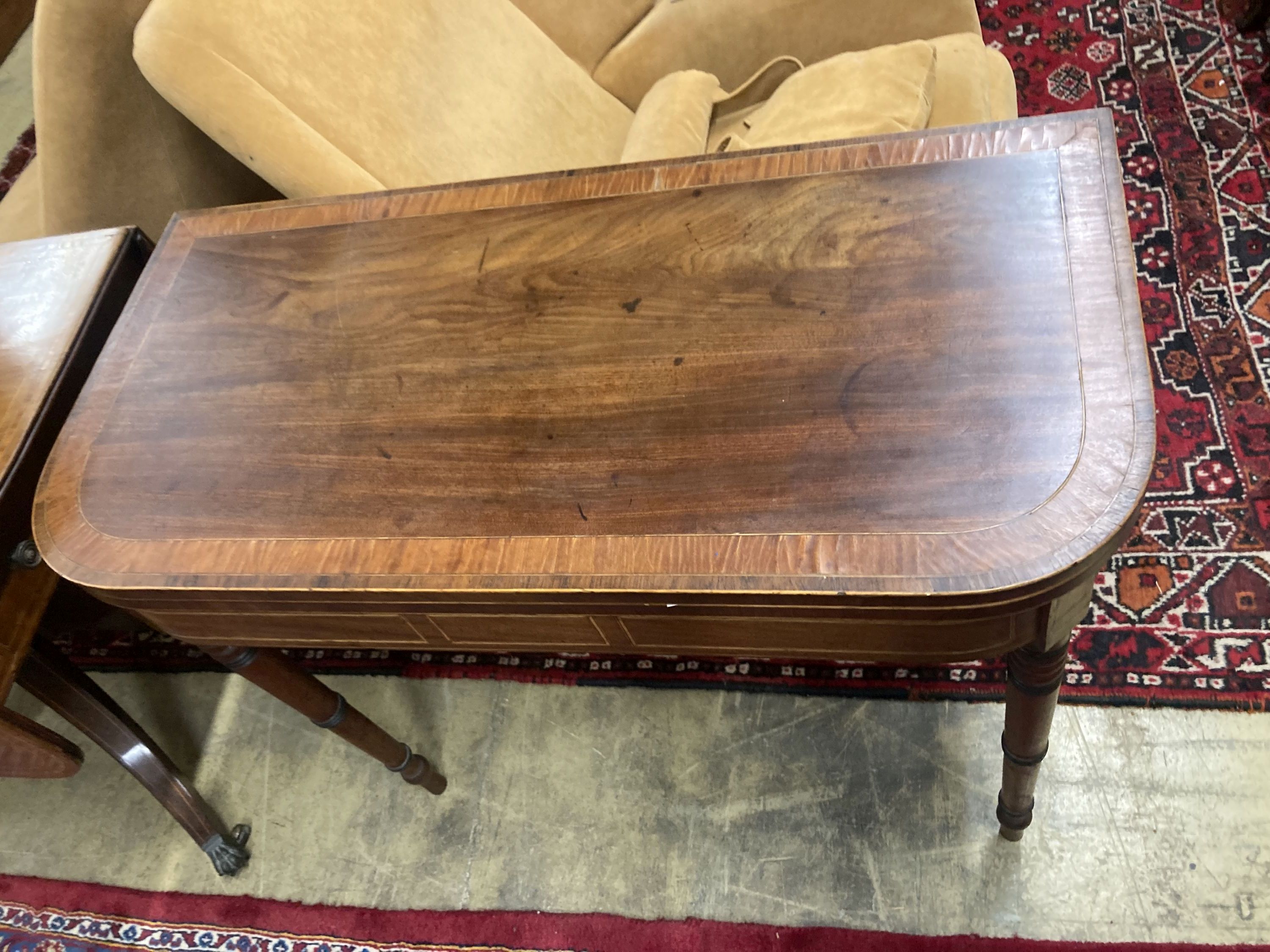 A George IV satinwood banded mahogany folding card table, width 90cm, depth 44cm, height 73cm